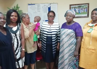 The Secretary LHCHF, Dr. Francisca Odeka presenting The PTAP Medical Grant Receipt and Acknowledgement letter to Mrs. Ngozi Nwobi of Lady Dorcas Foundation.