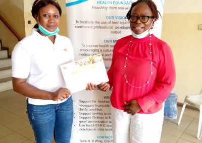 LHCHF Intern PEACE MPEKAP recieving her Certificate after 3months of internship