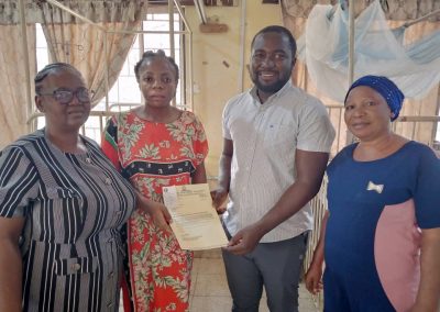 The LHCHF Admin Officer presenting PTAP medical Grant to the Mother of E.E to Support His Medical Treatment  at University of Abuja Teaching Hospital Gwagwalada. They are flanked by staff of Social Welfare Department of the Hospital 13/01/2023