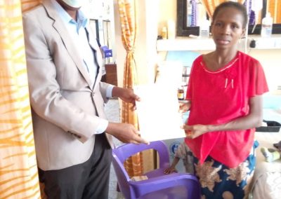 The LHCHF Program Administrator presenting PTAP medical Grant to the Mother of B.A to Support His Medical Treatment  at University of Abuja Teaching Hospital Gwagwalada. 13/01/2023