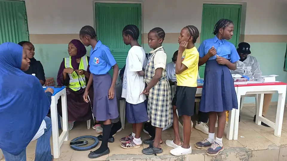 Secondary school children on a queue to have their anthropometric measurements taken.