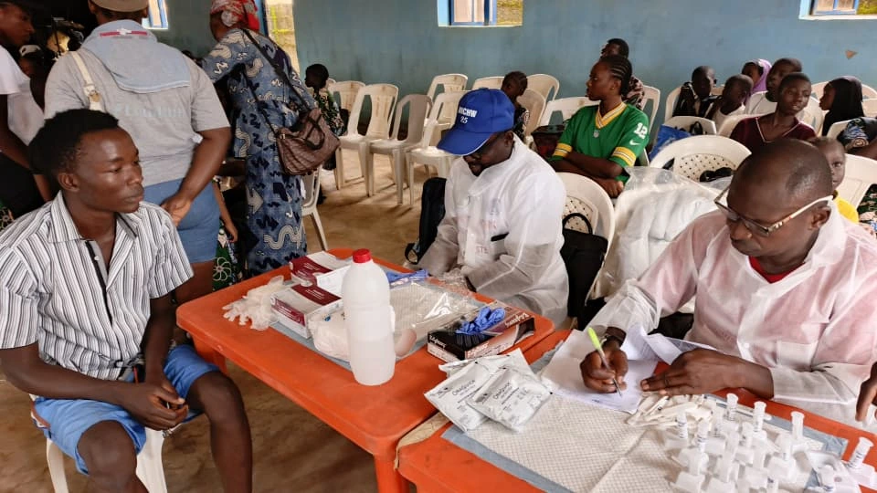 HIV and Malaria tests being conducted on an inhabitant of the care home.