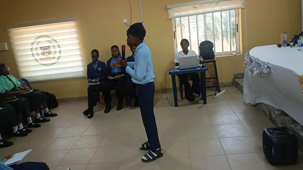 A member of the opposing team from Government Secondary School rebutting his opponent's views