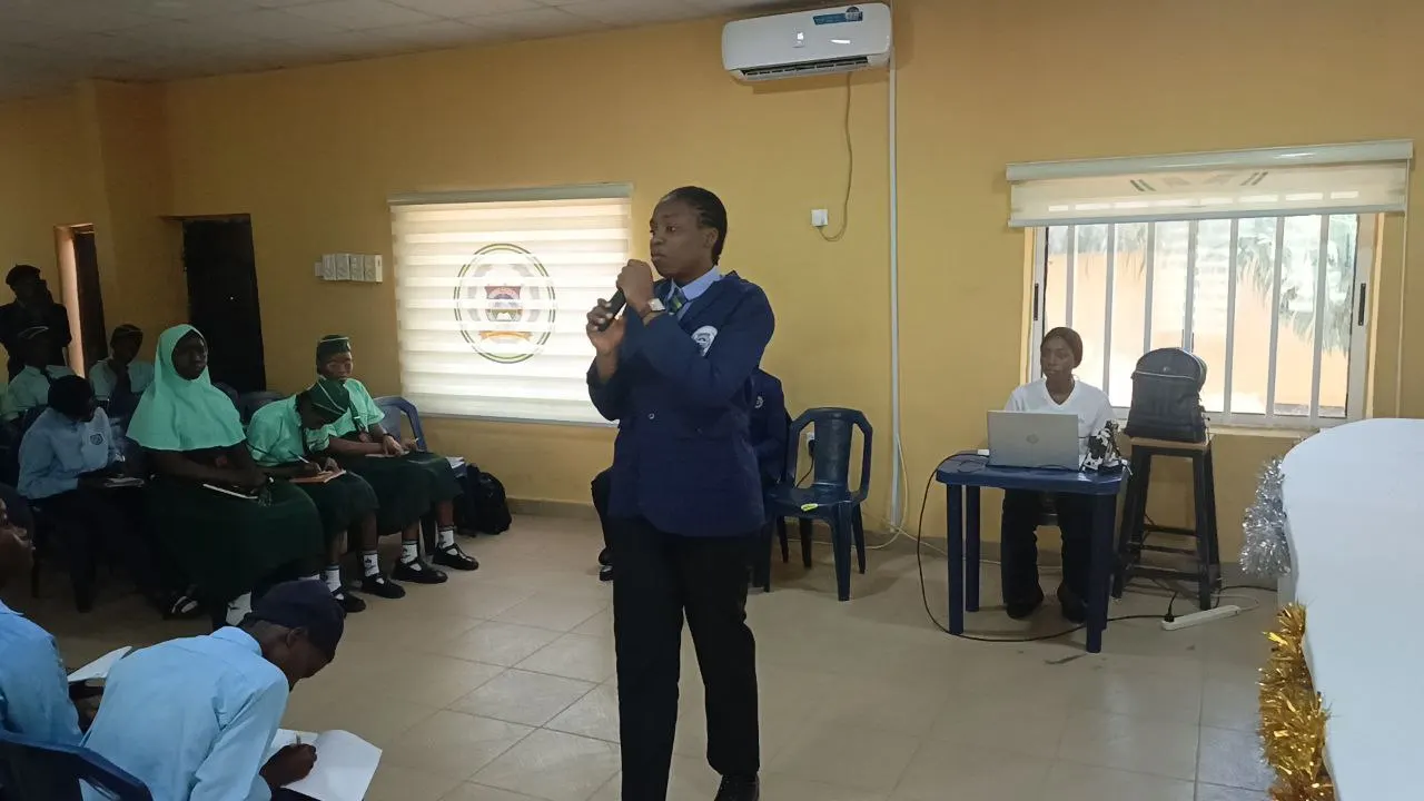 A member of the proposing team from Police Day Secondary School providing her opening argument