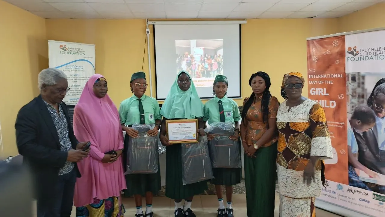 The Command Day winning students with the debate coach and representatives of the FCT Secondary Schools Education Board