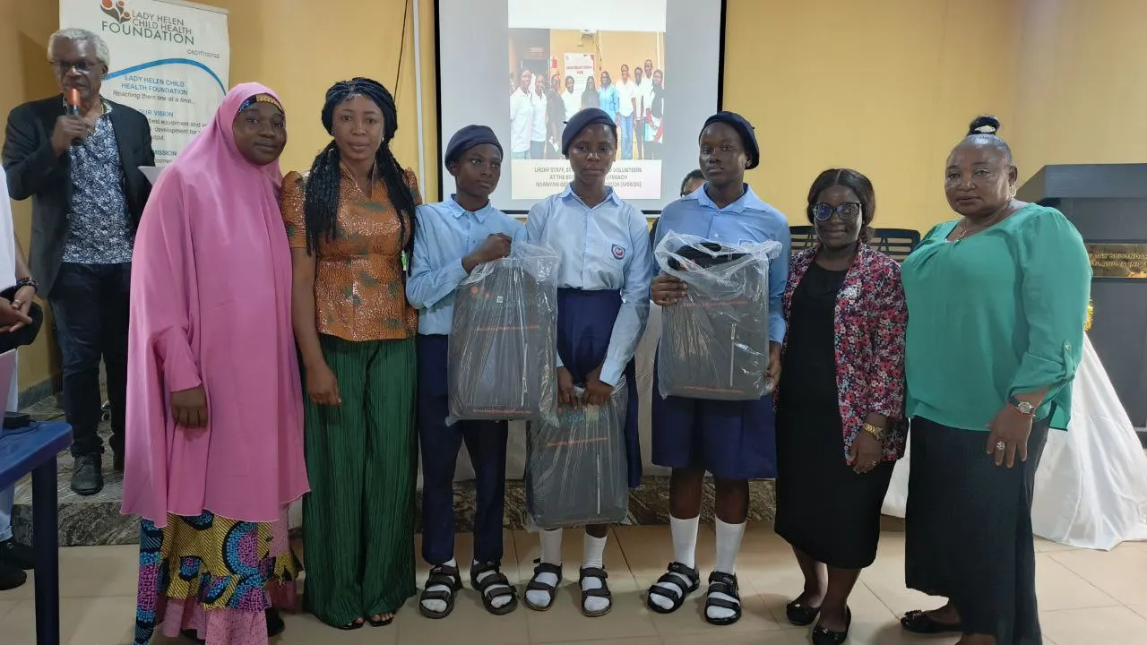The second runner up students of Government Secondary School with bags containing branded notebooks from CWAY Integrated Abuja and branded prizes from Lady Helen Child Health Foundation with their debate coach and members of the FCT Secondary School Education Board